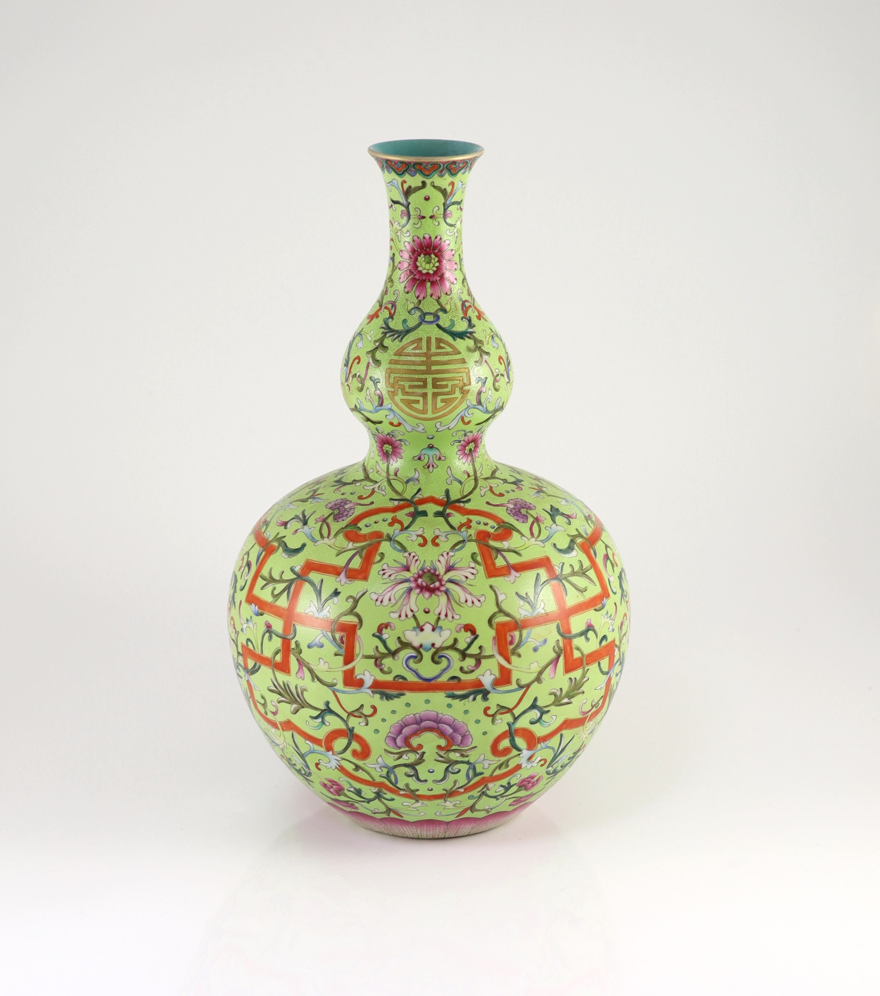 A Chinese lime green sgraffito ground double gourd vase, Qianlong mark but later, 40cm high